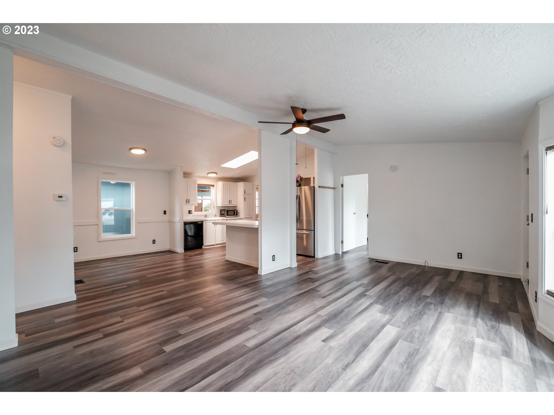 1401 West Ellendale Avenue, Unit 80 Dallas, OR 97338 - Photo 10 of 48 a view of empty room with wooden floor