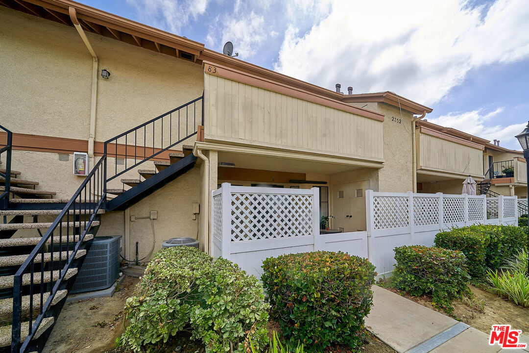 2252 Cheyenne Way, Unit 83 Fullerton, CA 92833 - Photo 1 of 1 a front view of a house with a garage