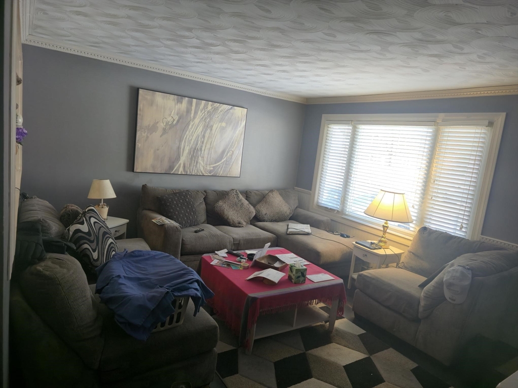 289 Commercial Street Whitman, MA 02382 - Photo 3 of 6 a living room with furniture and a window