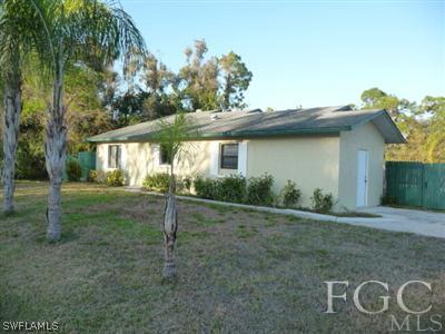19095 Flamingo Road Fort Myers, FL 33967 - Photo 1 of 9 a view of a house with a yard
