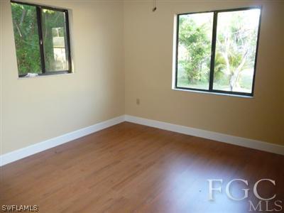 19095 Flamingo Road Fort Myers, FL 33967 - Photo 6 of 9 an empty room with windows
