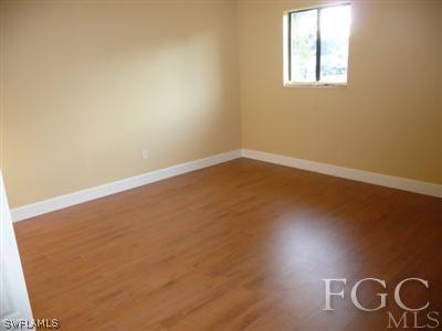 19095 Flamingo Road Fort Myers, FL 33967 - Photo 7 of 9 an empty room with windows