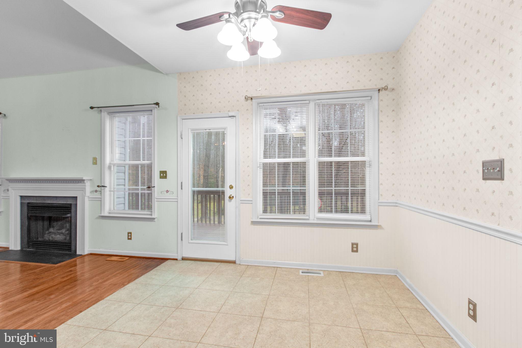 10721 Colbys Lane King George, VA 22485 - Photo 13 of 50 a view of an empty room with a window and kitchen view