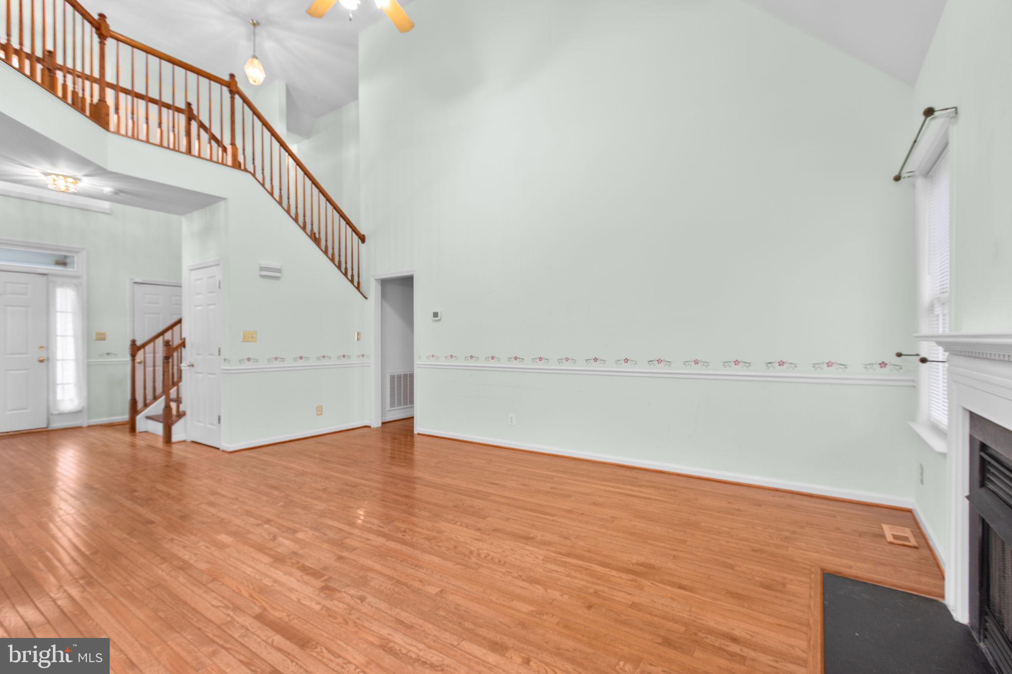 10721 Colbys Lane King George, VA 22485 - Photo 15 of 50 a view of an empty room with wooden floor