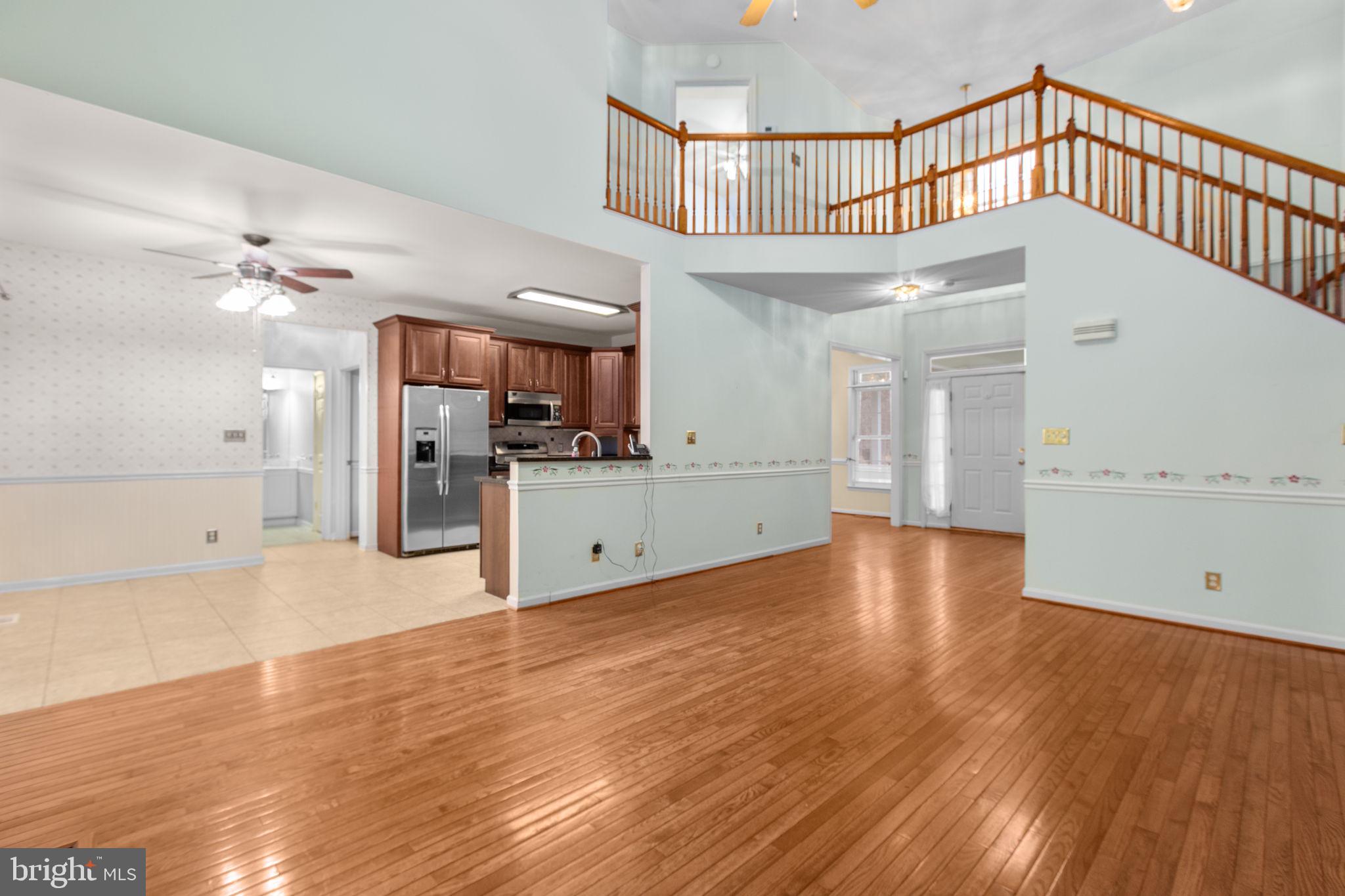 10721 Colbys Lane King George, VA 22485 - Photo 16 of 50 a view of a kitchen with a sink and cabinet area with wooden floor
