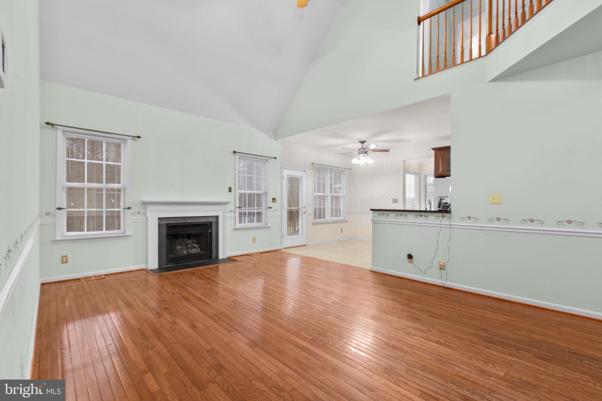 10721 Colbys Lane King George, VA 22485 - Photo 17 of 50 a view of empty room with wooden floor and a window