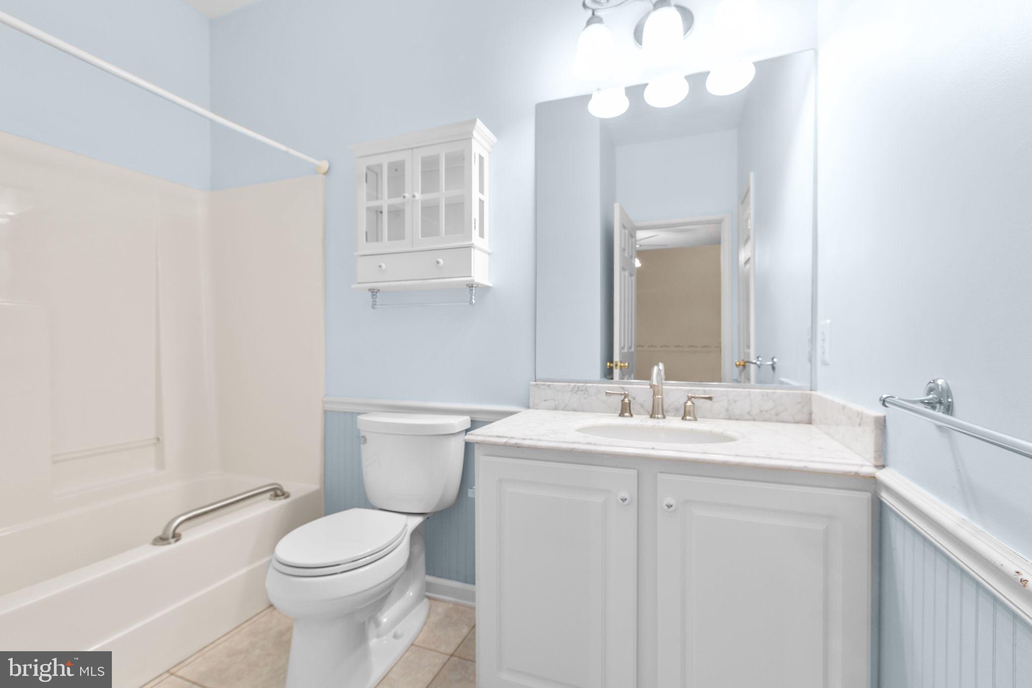 10721 Colbys Lane King George, VA 22485 - Photo 25 of 50 a bathroom with a sink a toilet and a mirror