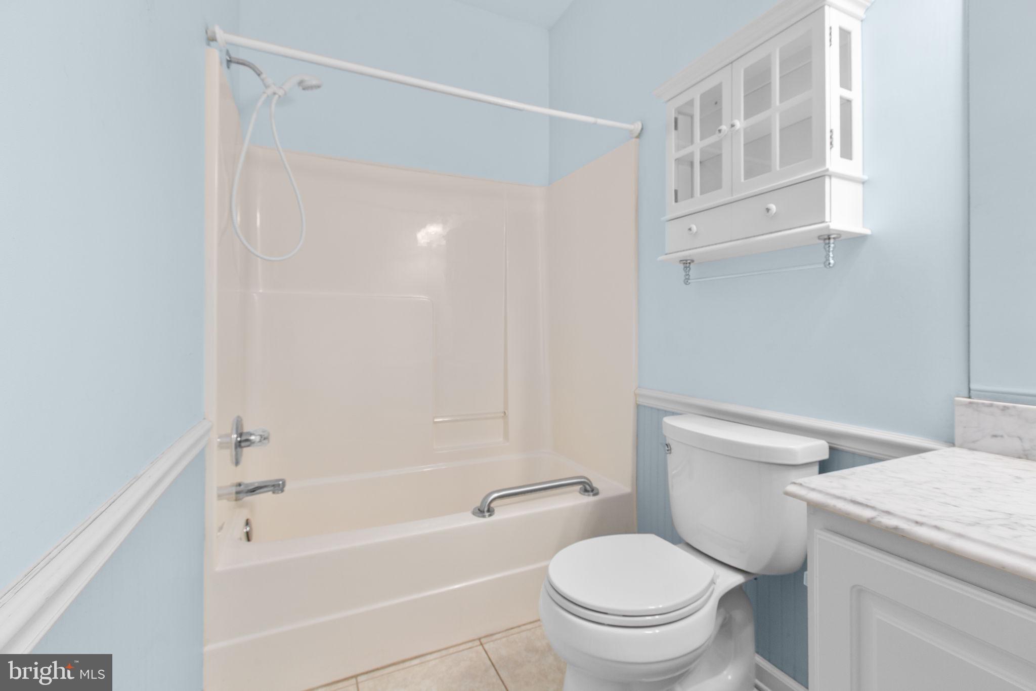 10721 Colbys Lane King George, VA 22485 - Photo 26 of 50 a white toilet sitting next to a bath tub