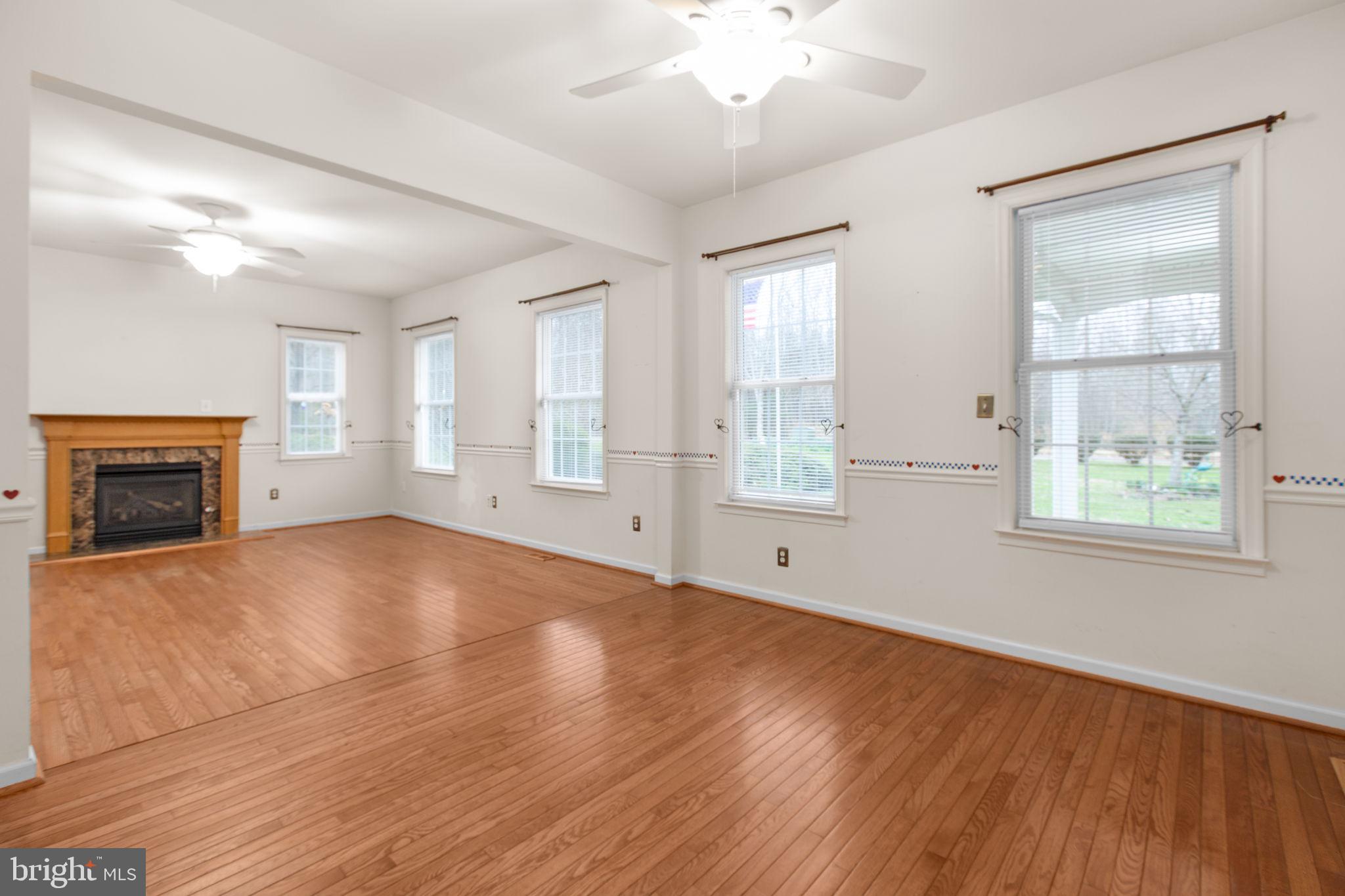 10721 Colbys Lane King George, VA 22485 - Photo 27 of 50 a view of empty room with wooden floor and fan