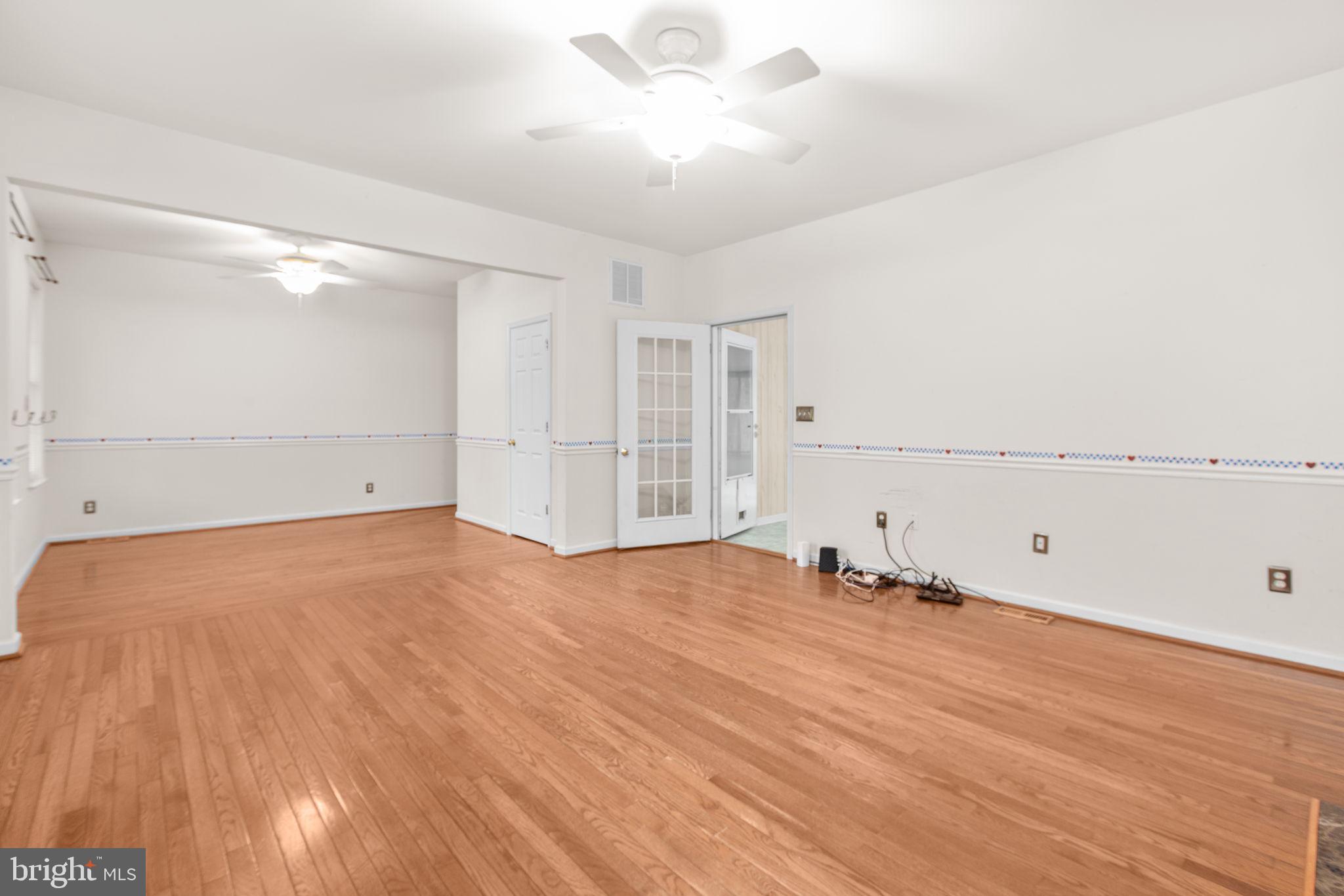 10721 Colbys Lane King George, VA 22485 - Photo 29 of 50 a view of empty room with wooden floor