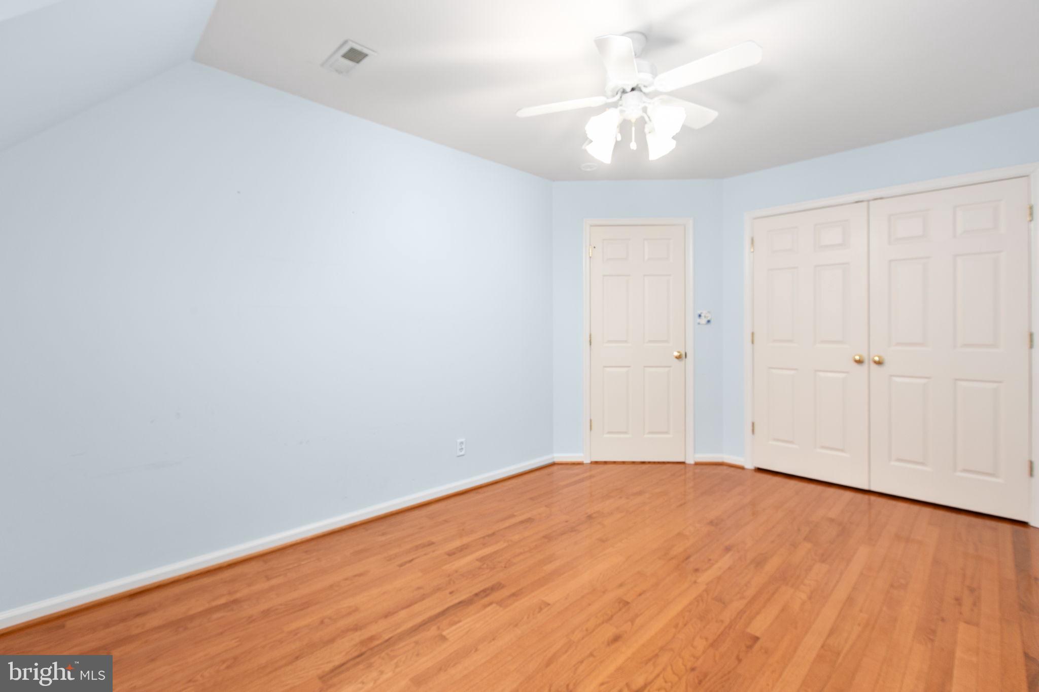 10721 Colbys Lane King George, VA 22485 - Photo 35 of 50 a view of empty room with wooden floor