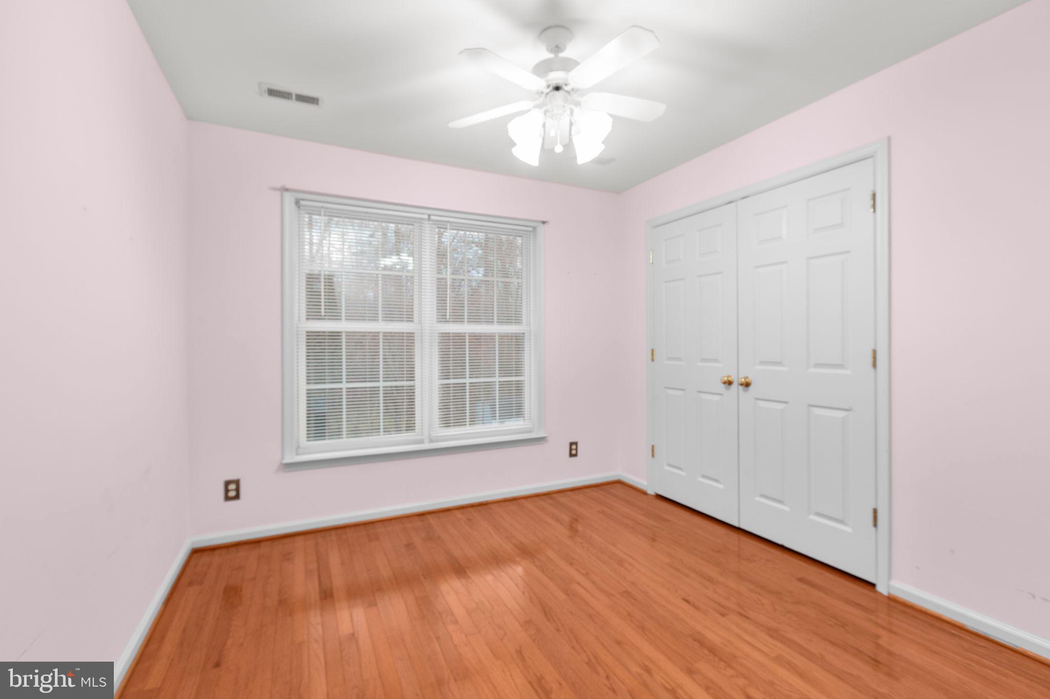 10721 Colbys Lane King George, VA 22485 - Photo 36 of 50 an empty room with a window and a ceiling fan