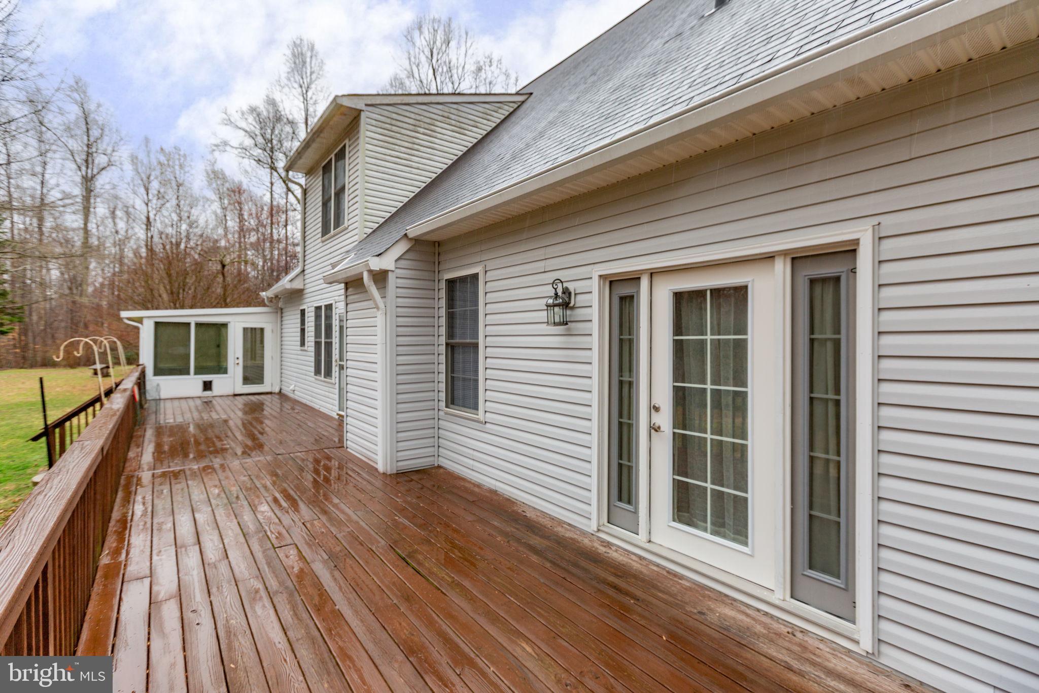 10721 Colbys Lane King George, VA 22485 - Photo 40 of 50 a view of backyard with deck and wooden floor
