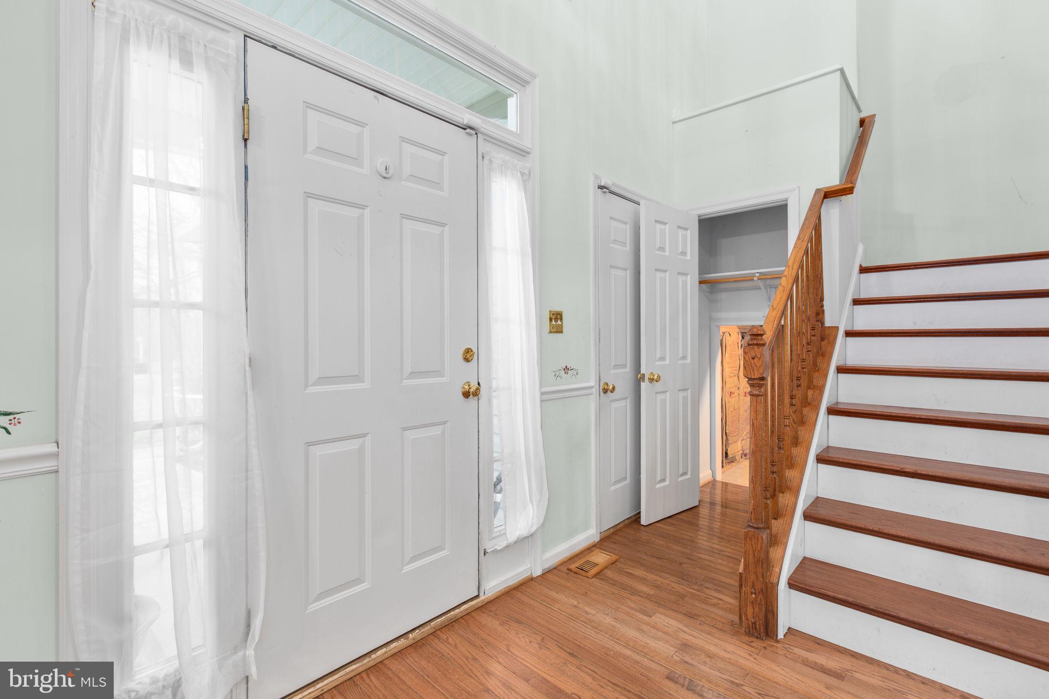 10721 Colbys Lane King George, VA 22485 - Photo 5 of 50 a view of a hallway with wooden floor and entryway