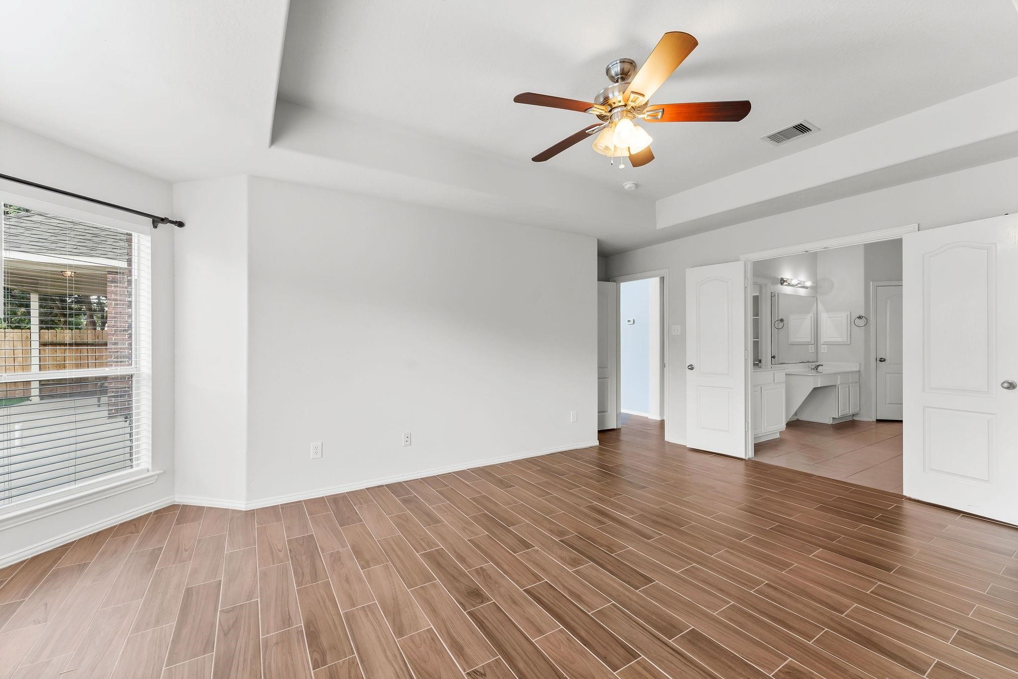 29902 Legends Ridge Drive Spring, TX 77386 - Photo 16 of 29 wooden floor in an empty room with a window