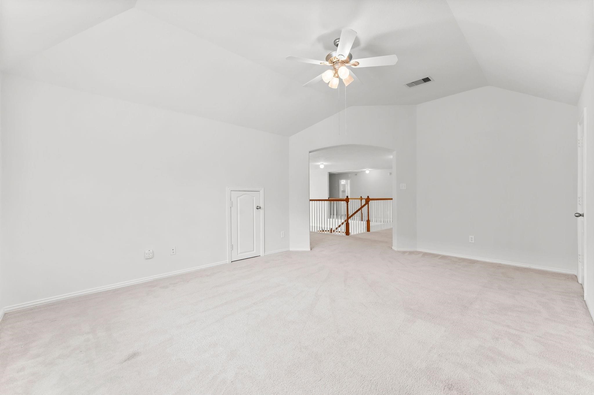 29902 Legends Ridge Drive Spring, TX 77386 - Photo 20 of 29 a view of an empty room with a chandelier fan