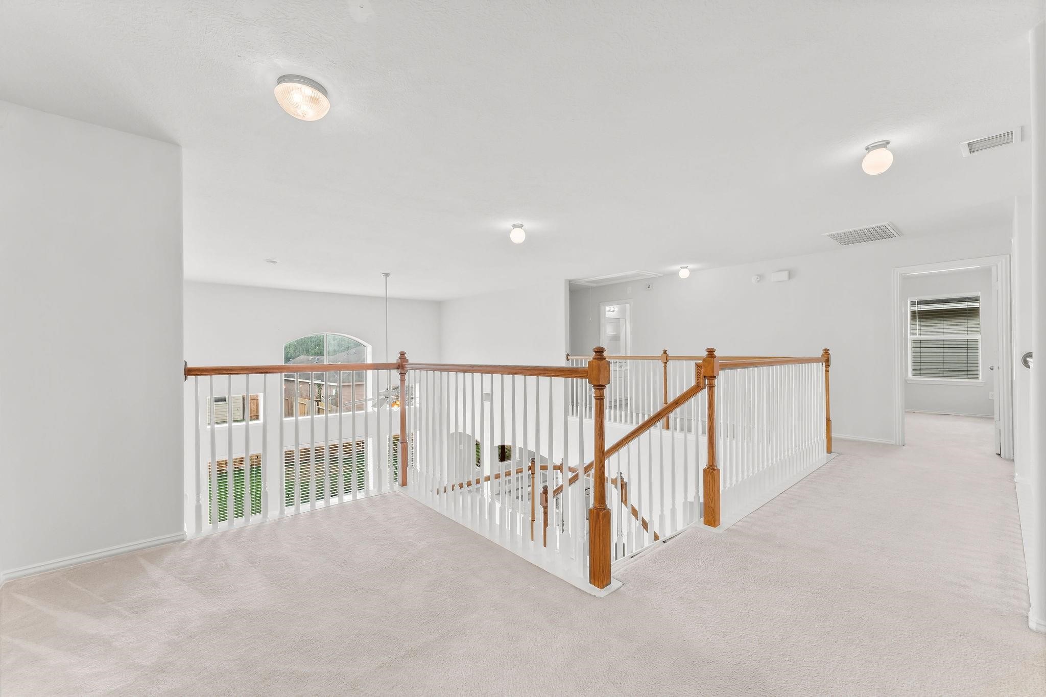 29902 Legends Ridge Drive Spring, TX 77386 - Photo 21 of 29 a view of a hallway with seating area