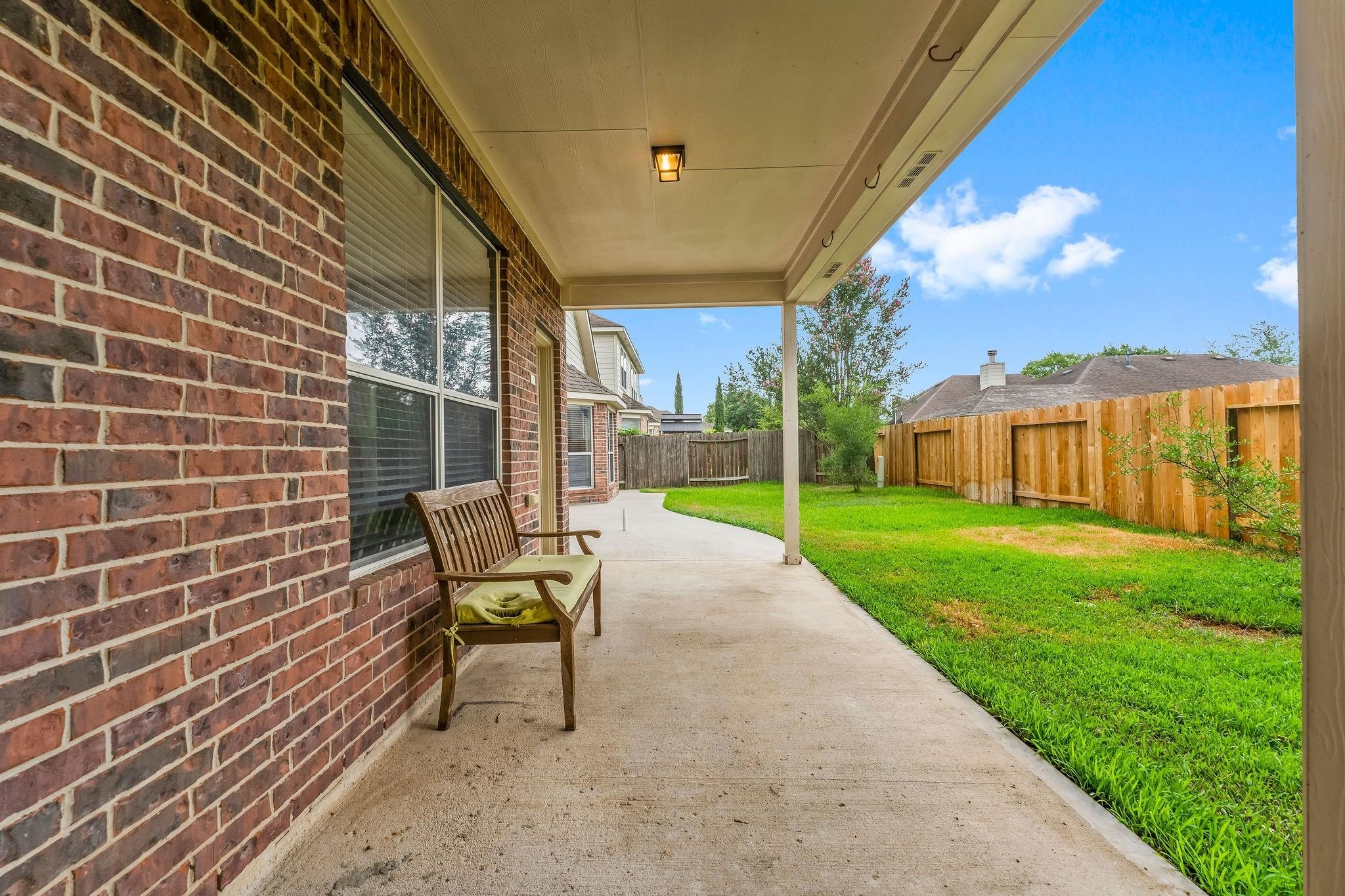 29902 Legends Ridge Drive Spring, TX 77386 - Photo 29 of 29 a view of a patio with a table and chairs