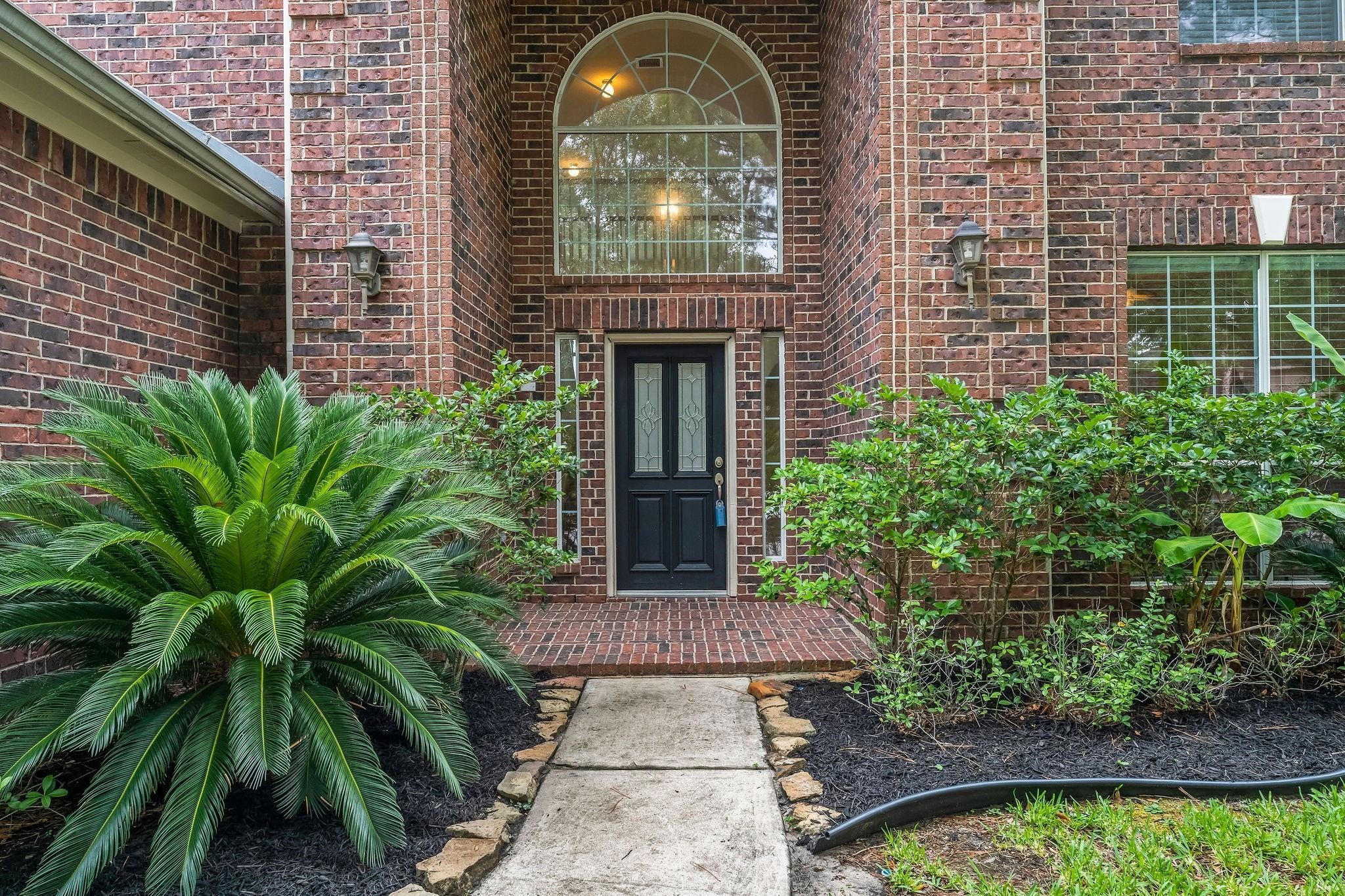29902 Legends Ridge Drive Spring, TX 77386 - Photo 3 of 29 a front view of a house with garden