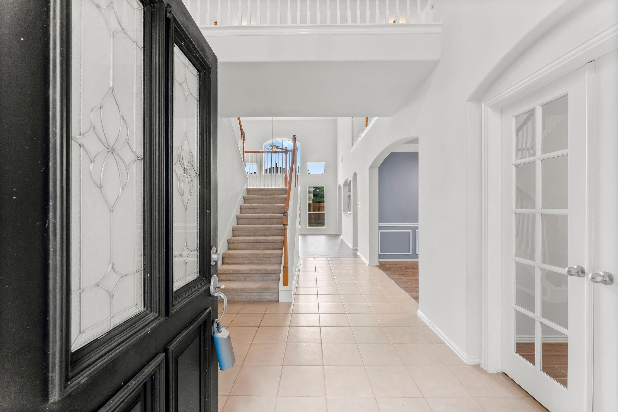 29902 Legends Ridge Drive Spring, TX 77386 - Photo 4 of 29 a view of a hallway with wooden floor and staircase