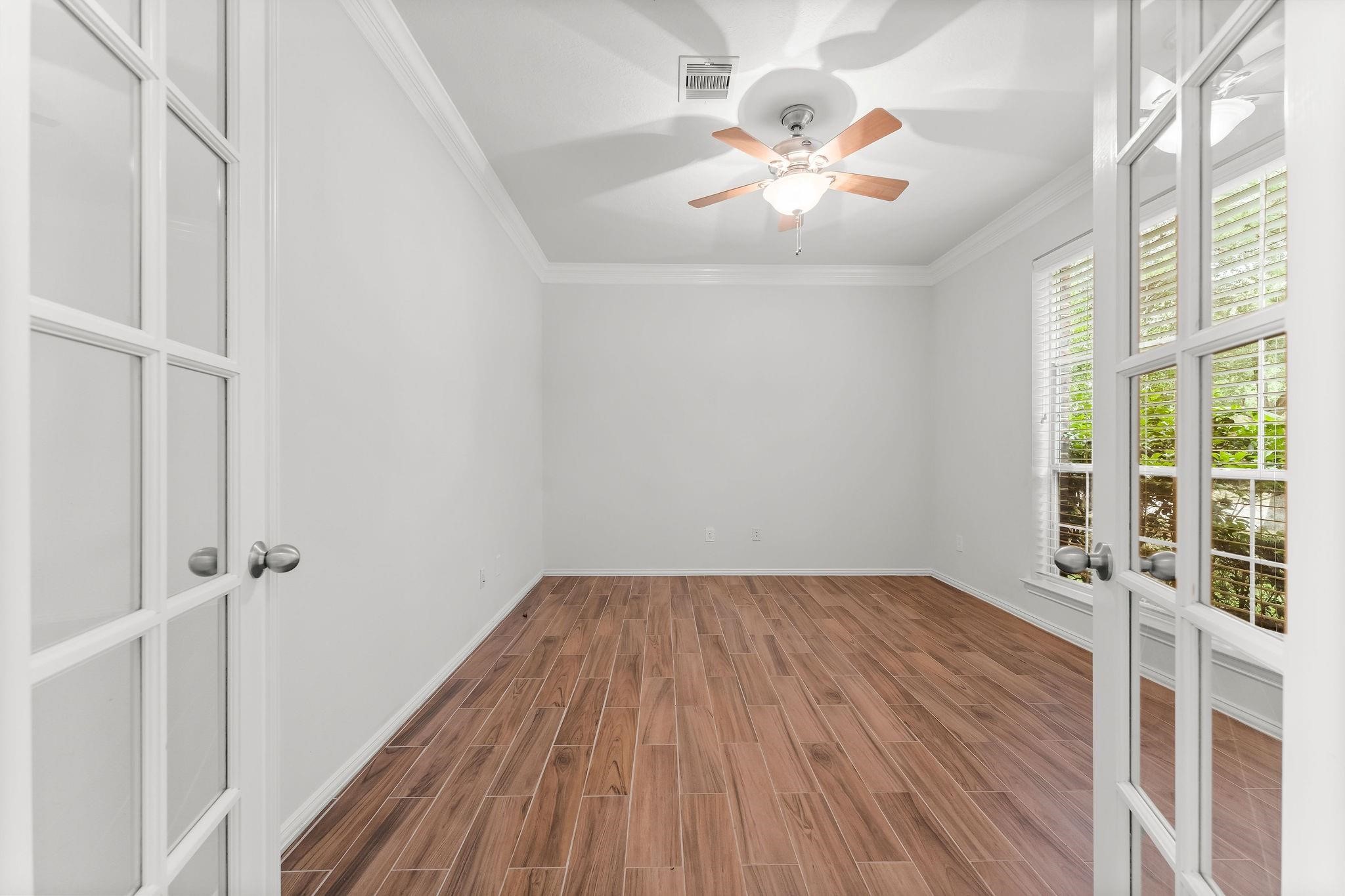 29902 Legends Ridge Drive Spring, TX 77386 - Photo 6 of 29 wooden floor in an empty room with a window