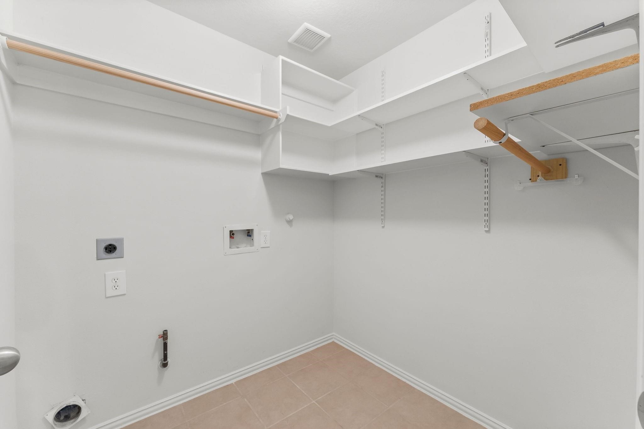 29902 Legends Ridge Drive Spring, TX 77386 - Photo 8 of 29 a view of a room with racks on the wall