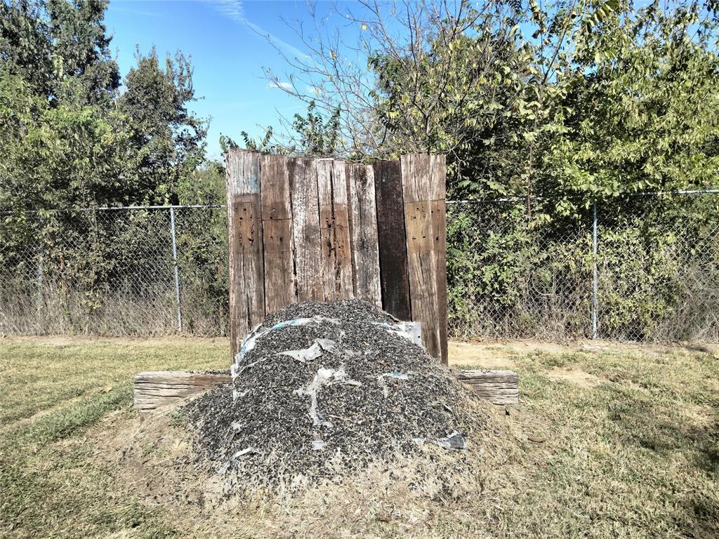 855 Tom Sawyer Road Ennis, TX 75119 - Photo 11 of 17 a view of backyard with green space