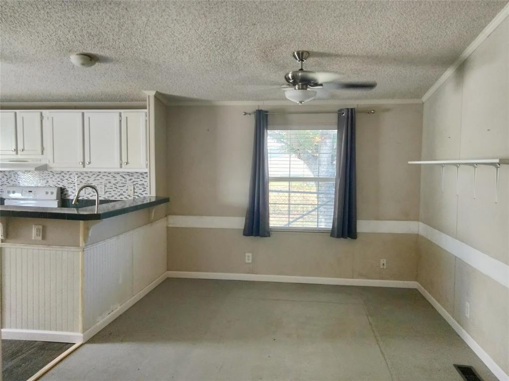 855 Tom Sawyer Road Ennis, TX 75119 - Photo 15 of 17 a bathroom with a granite countertop sink and a mirror