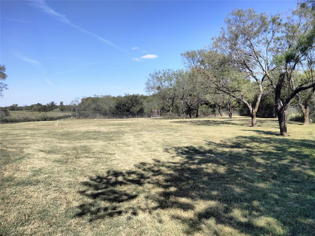 855 Tom Sawyer Road Ennis, TX 75119 - Photo 8 of 17 a view of a yard with a lake view