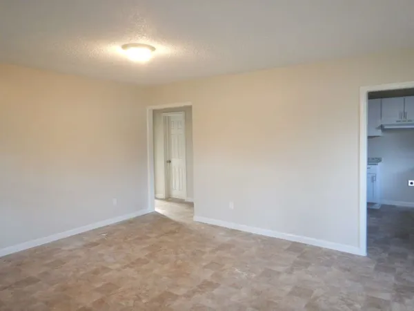 a view of an empty room and window