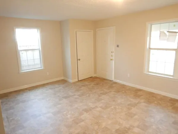 an empty room with windows