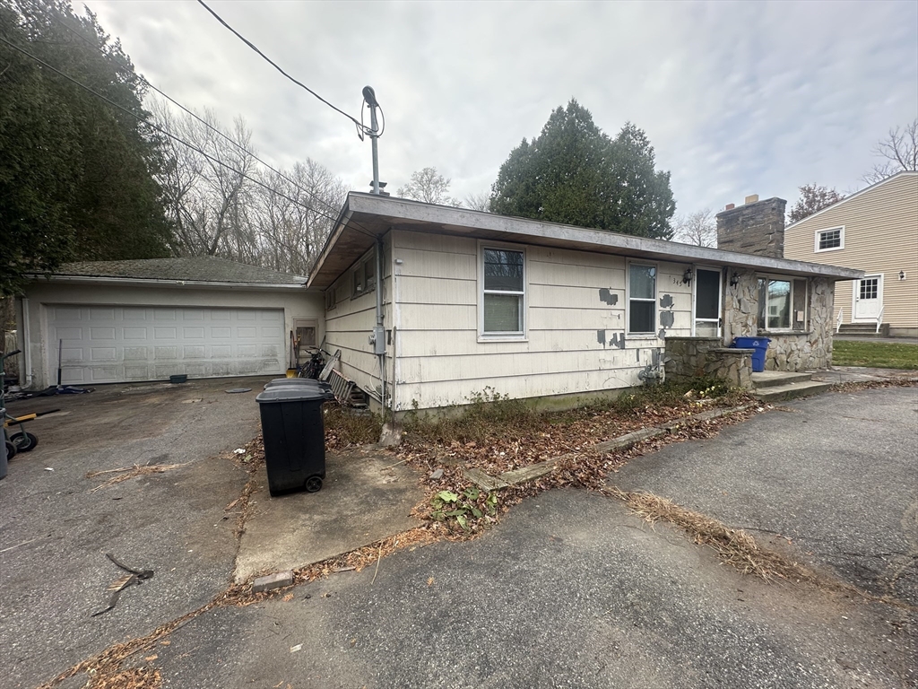 a backyard of a house with yard and garage