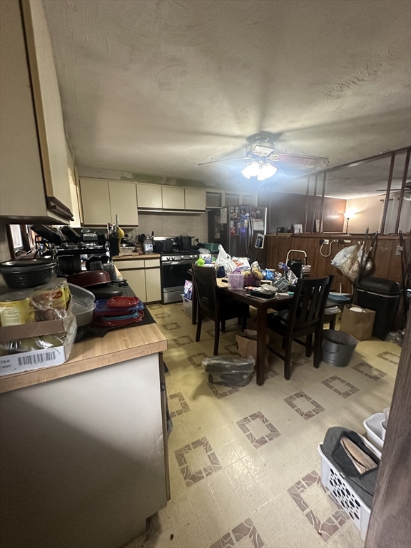 345 Chace Street Somerset, MA 02726 - Photo 6 of 18 a living room with lots of furniture and a view of kitchen