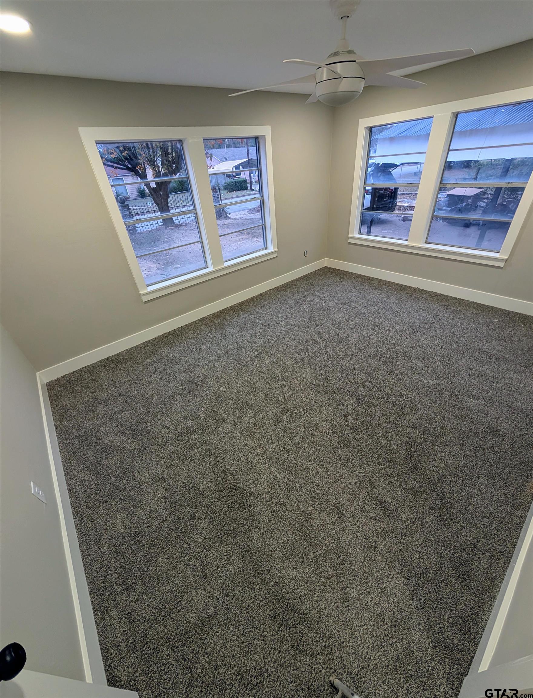 1213 Academy Street Tyler, TX 75701 - Photo 30 of 41 an empty room with windows