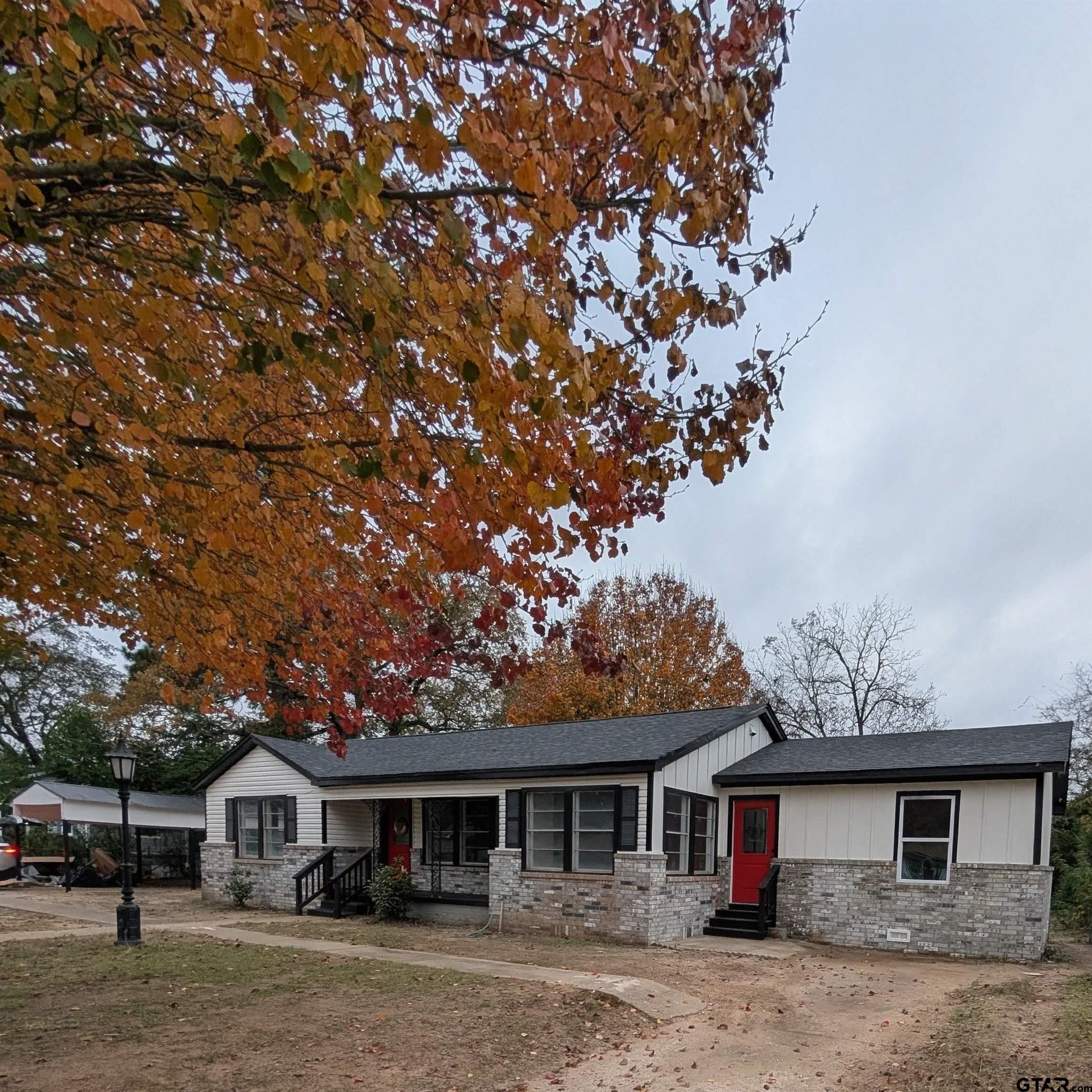 1213 Academy Street Tyler, TX 75701 - Photo 35 of 41 a front view of a house with garden