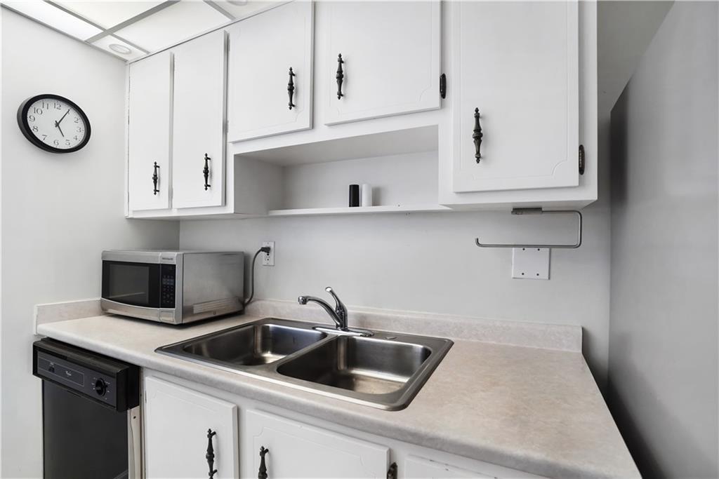 Undisclosed Address Sunny Isles Beach, FL 33160 - Photo 7 of 7 a kitchen with white cabinets and a sink