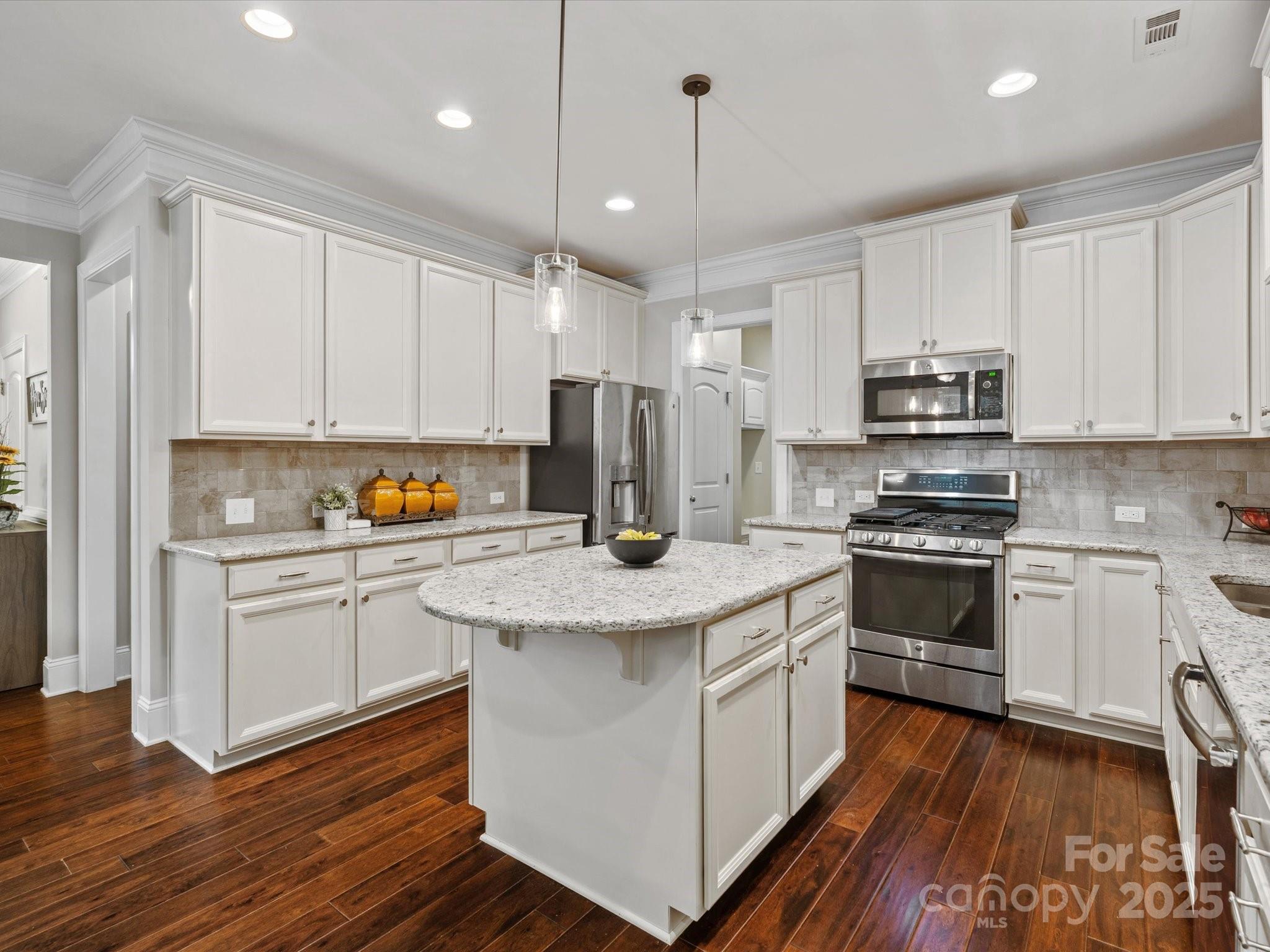 130 Villa Lake Drive Fort Mill, SC 29708 - Photo 11 of 46 a kitchen with stainless steel appliances granite countertop a stove a sink and a refrigerator
