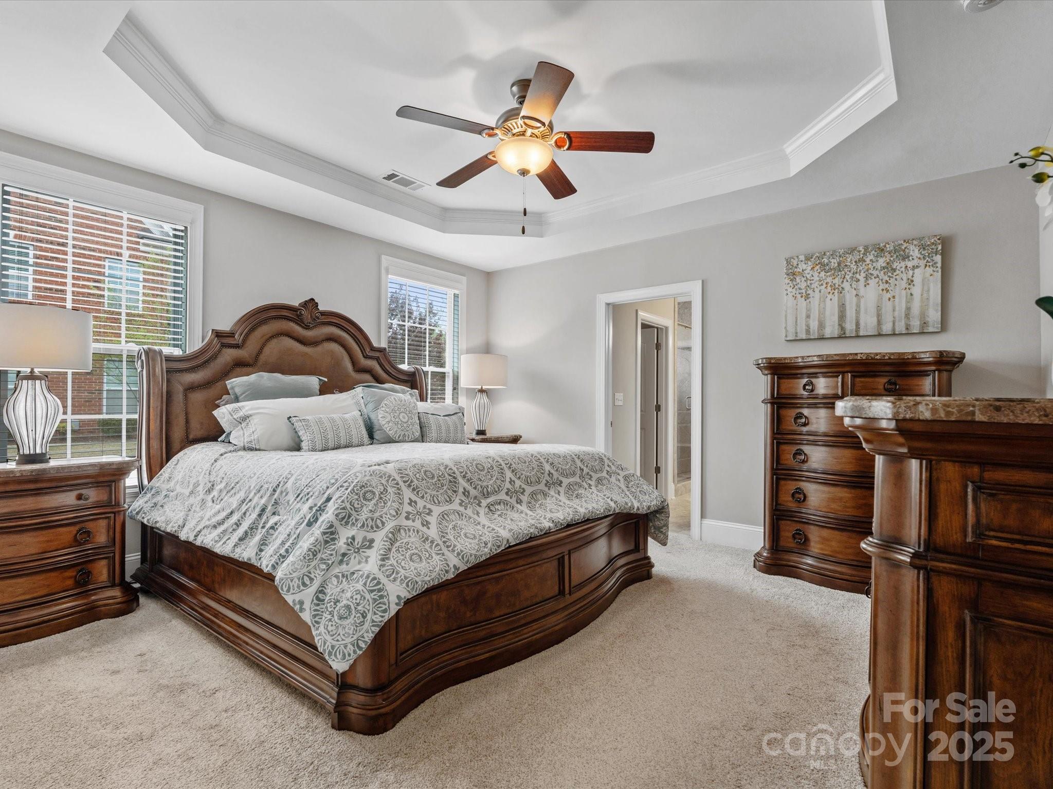 130 Villa Lake Drive Fort Mill, SC 29708 - Photo 17 of 46 a spacious bedroom with a bed and ceiling fan