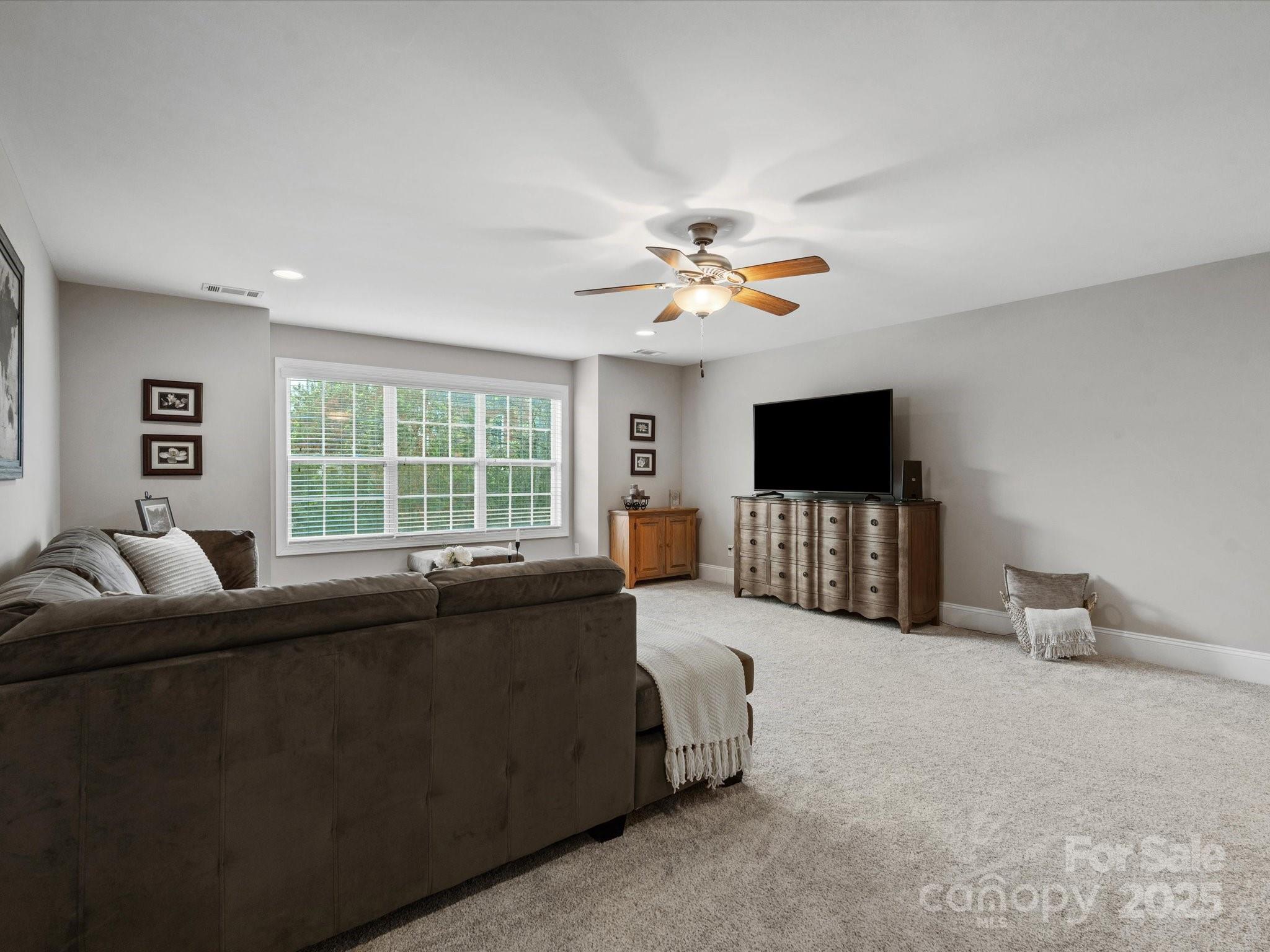 130 Villa Lake Drive Fort Mill, SC 29708 - Photo 28 of 46 a living room with furniture window and a flat screen tv