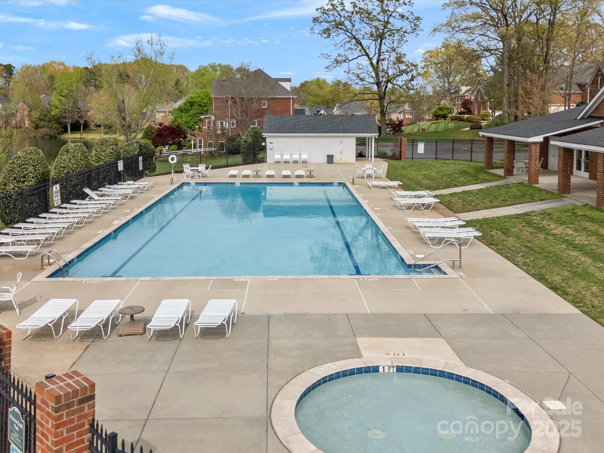 130 Villa Lake Drive Fort Mill, SC 29708 - Photo 42 of 46 a view of a swimming pool with a lounge chairs