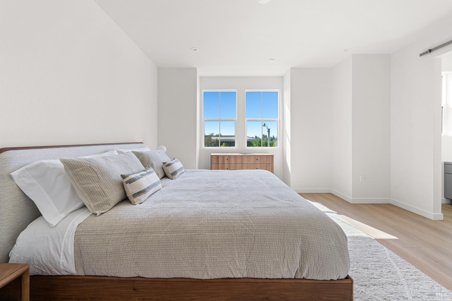 225 Wellness Way Rohnert Park, CA 94928 - Photo 12 of 21 a bedroom with a large bed and a window