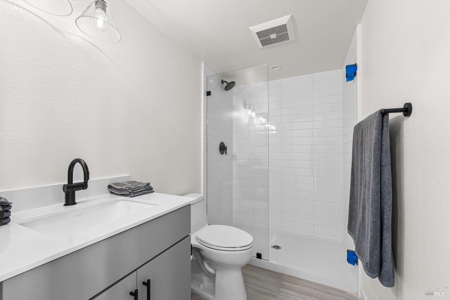225 Wellness Way Rohnert Park, CA 94928 - Photo 18 of 21 a bathroom with a sink a toilet and shower