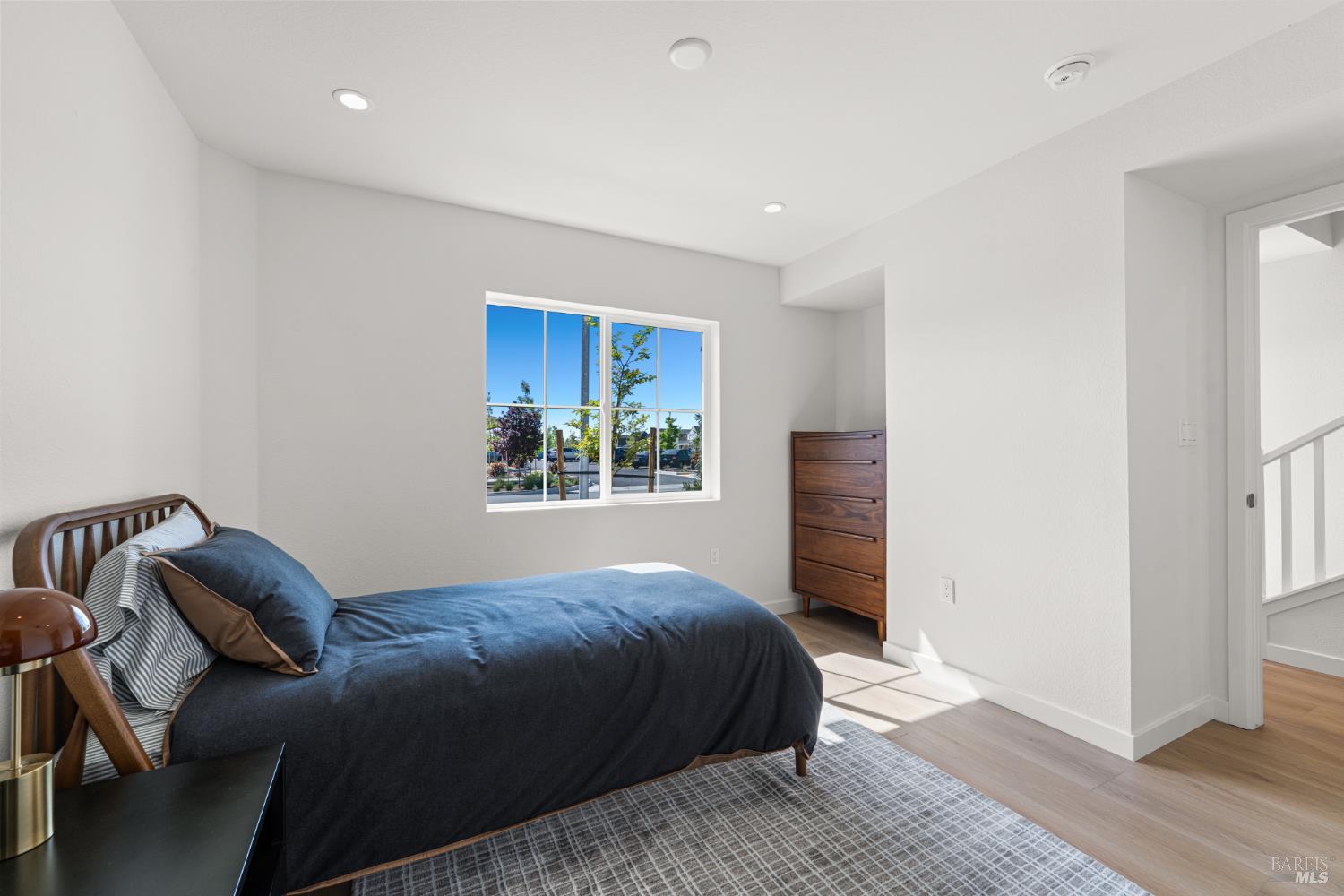 225 Wellness Way Rohnert Park, CA 94928 - Photo 20 of 21 a bedroom with a bed and a window