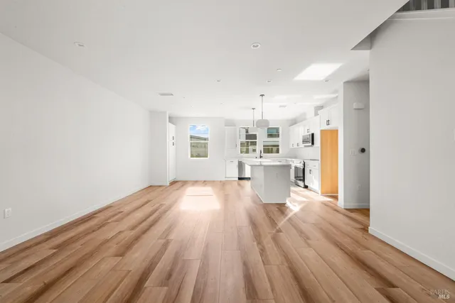 a view of kitchen with wooden floor
