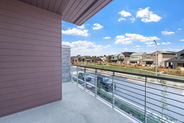 a view of a balcony with an outdoor seating