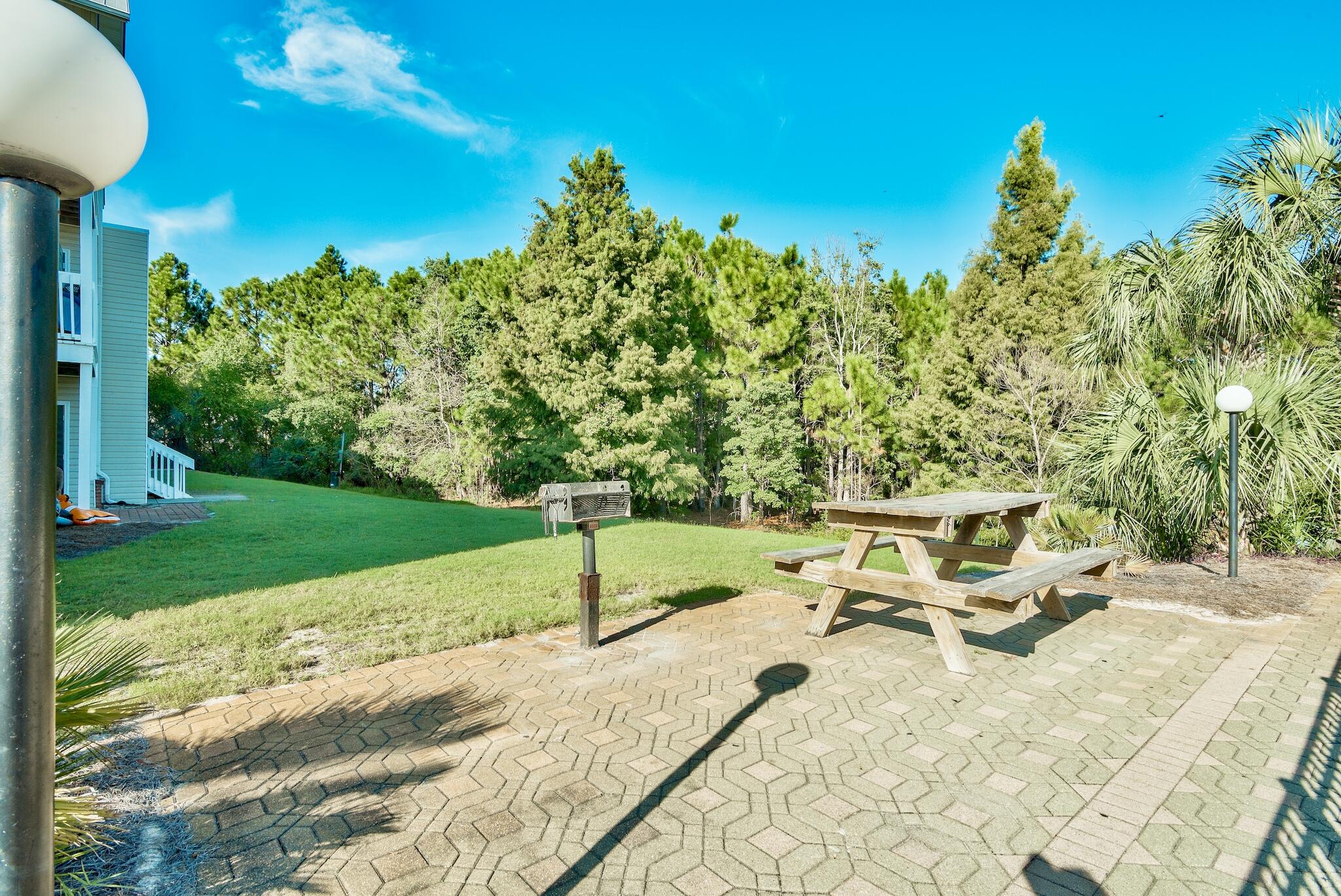 4070 Dancing Cloud Court, Unit 187 Destin, FL 32541 - Photo 11 of 20 a view of a backyard with sitting area