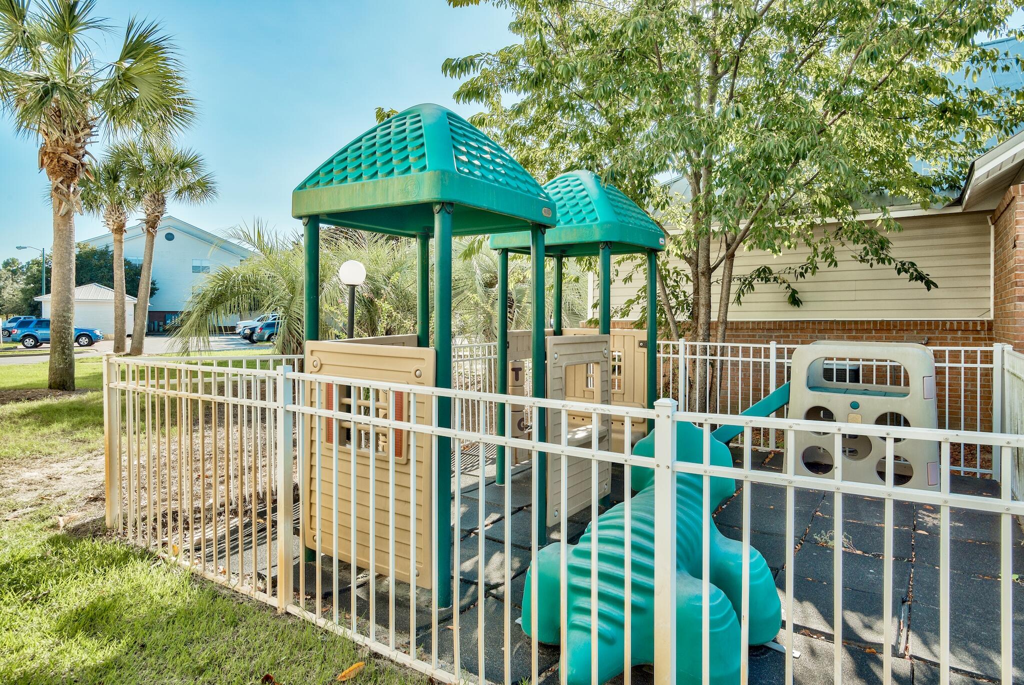 4070 Dancing Cloud Court, Unit 187 Destin, FL 32541 - Photo 14 of 20 a view of a house with a yard and plants