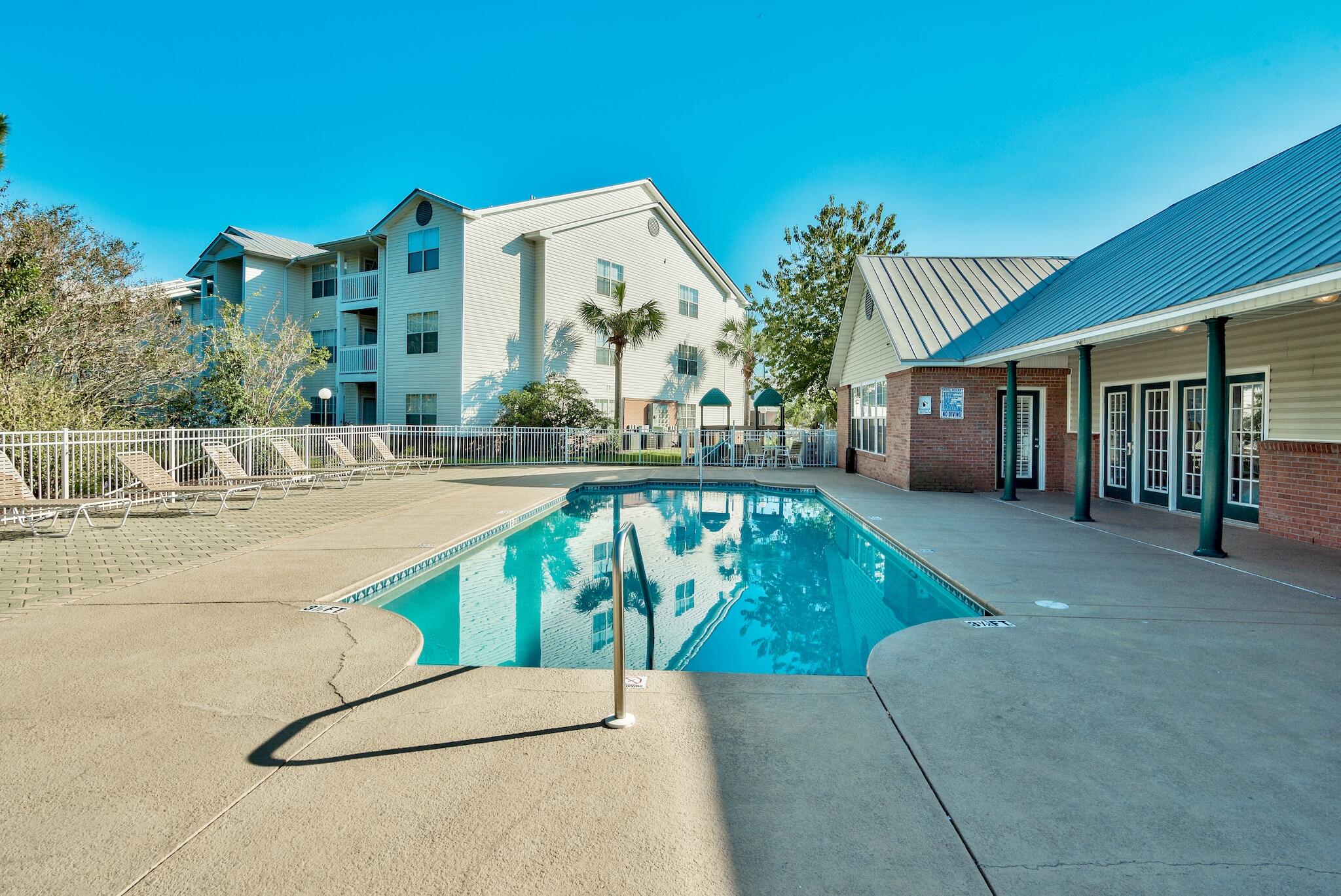 4070 Dancing Cloud Court, Unit 187 Destin, FL 32541 - Photo 4 of 20 a view of a house with swimming pool and sitting area