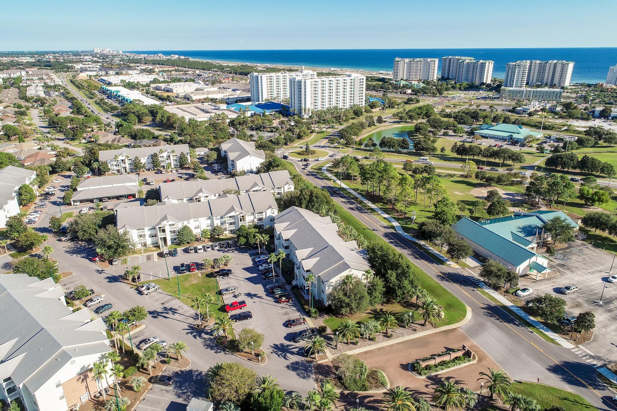 4070 Dancing Cloud Court, Unit 187 Destin, FL 32541 - Photo 6 of 20 a view of a lake with a building in the background