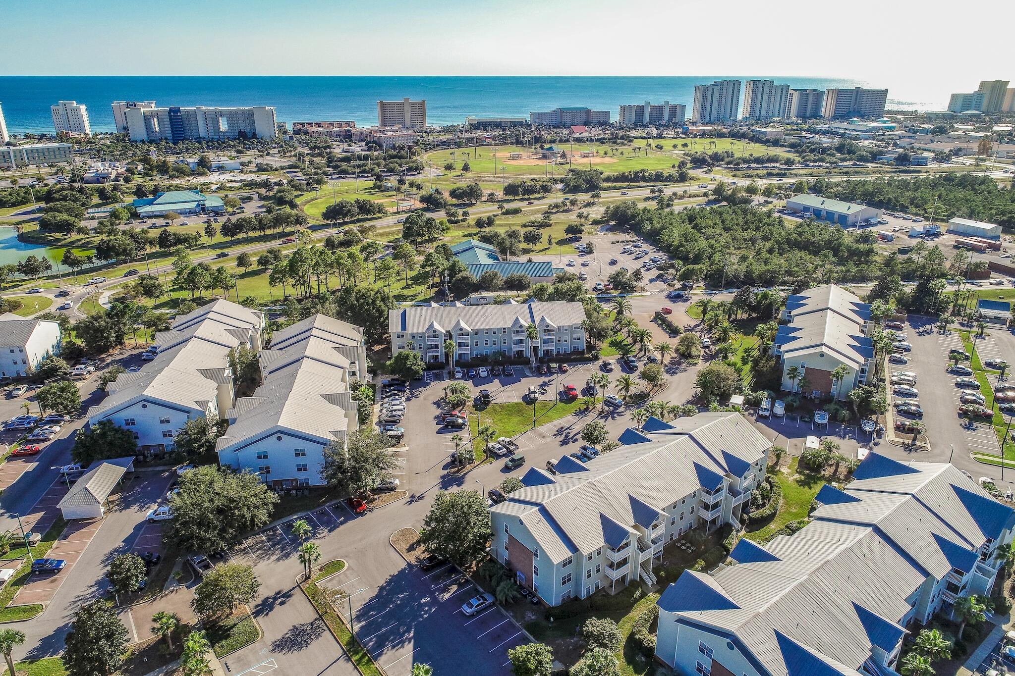 4070 Dancing Cloud Court, Unit 187 Destin, FL 32541 - Photo 7 of 20 an aerial view of residential building and parking space